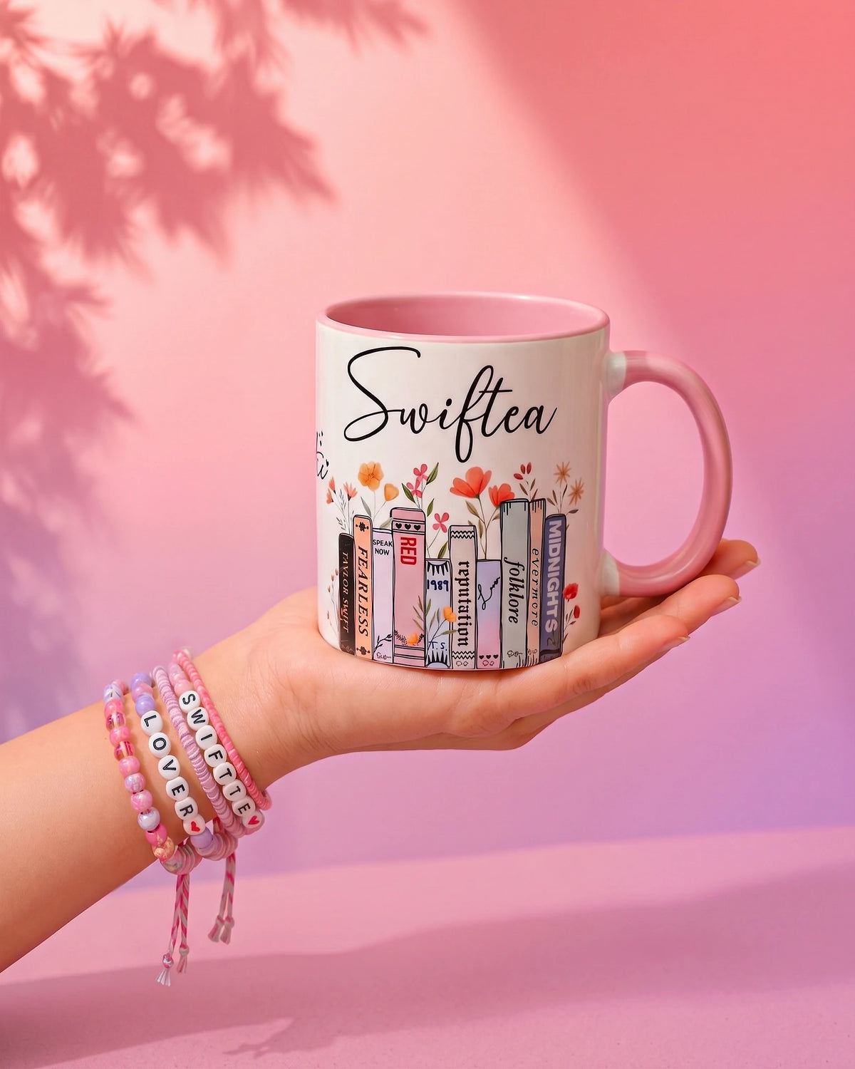 Swiftea ceramic mug with every Taylor Swift album lined up like a bookshelf