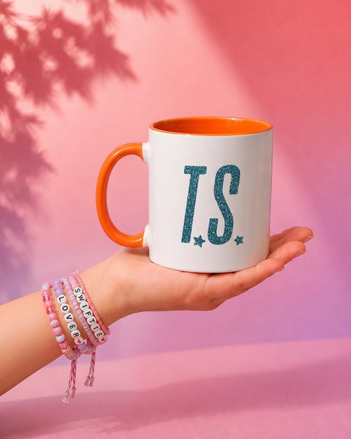 In My Showgirl Era mug showing the glitter T.S. side