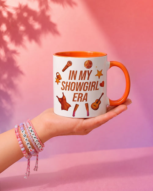 In My Showgirl Era mug with microphone, feathers and disco ball, burnt-orange handle