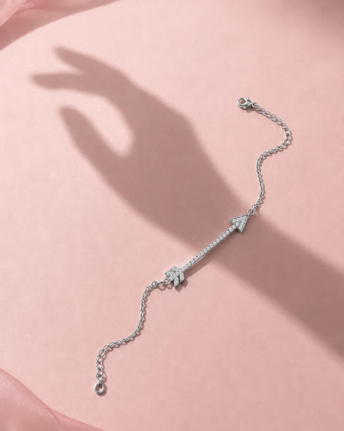 Close-up of the arrow charm on The Archer bracelet
