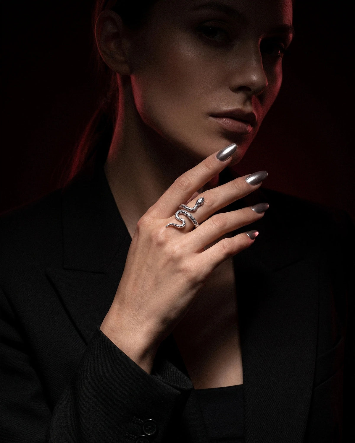 Reputation snake ring worn on a hand