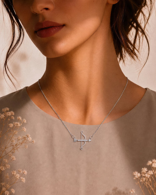 The Archer bow and arrow pendant necklace in gold tone